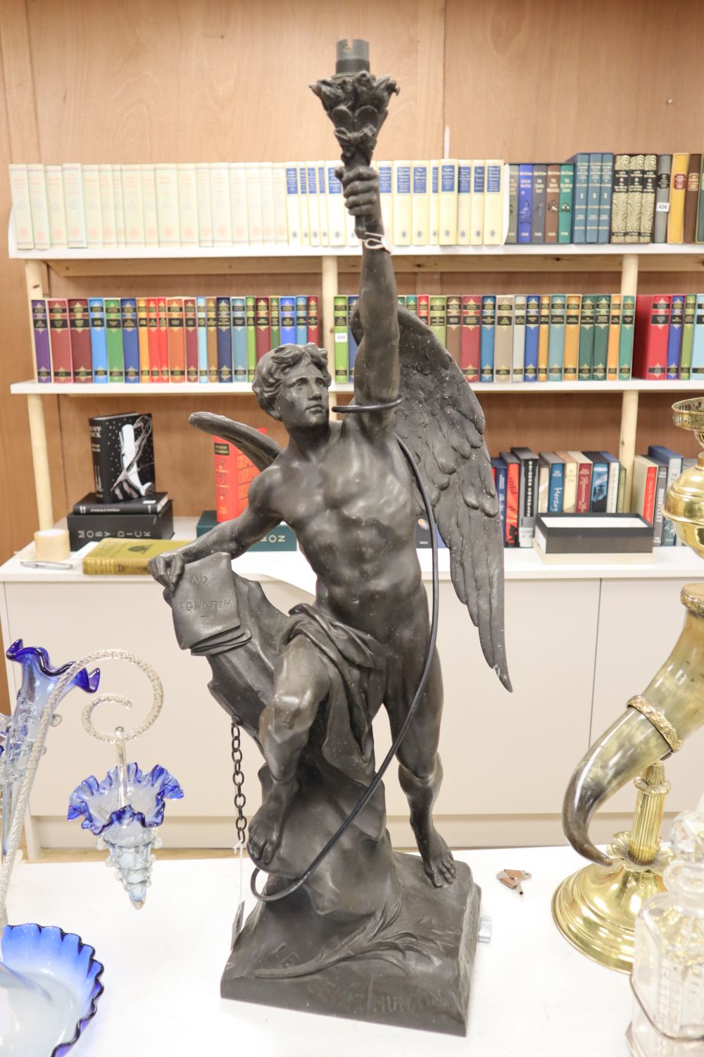 A large bronzed spelter figural lamp, entitled Le Genie Humain, converted to electric, 86cm